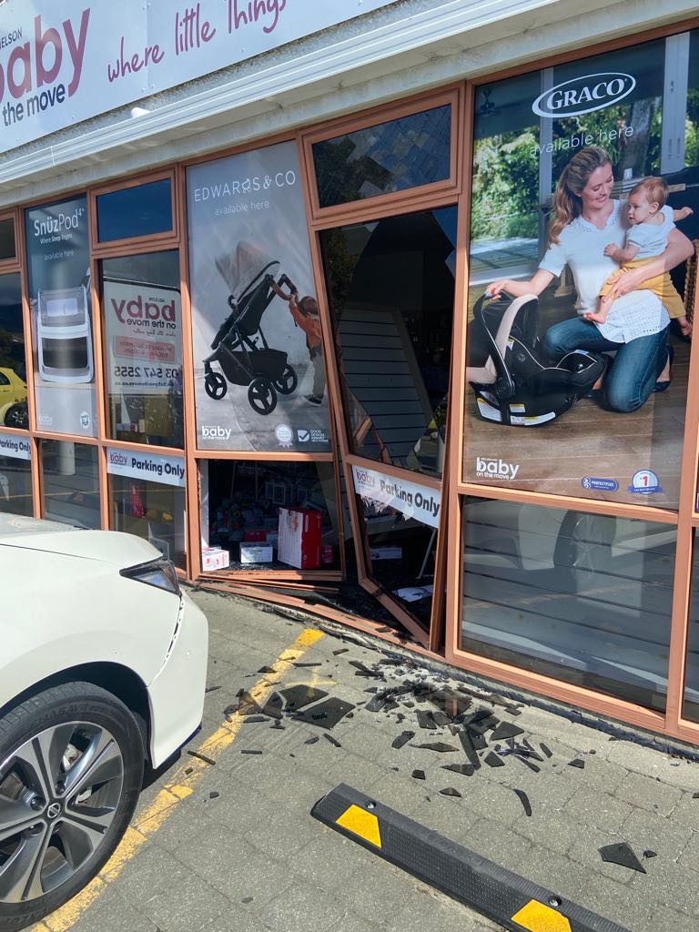 Car crashes through storefront