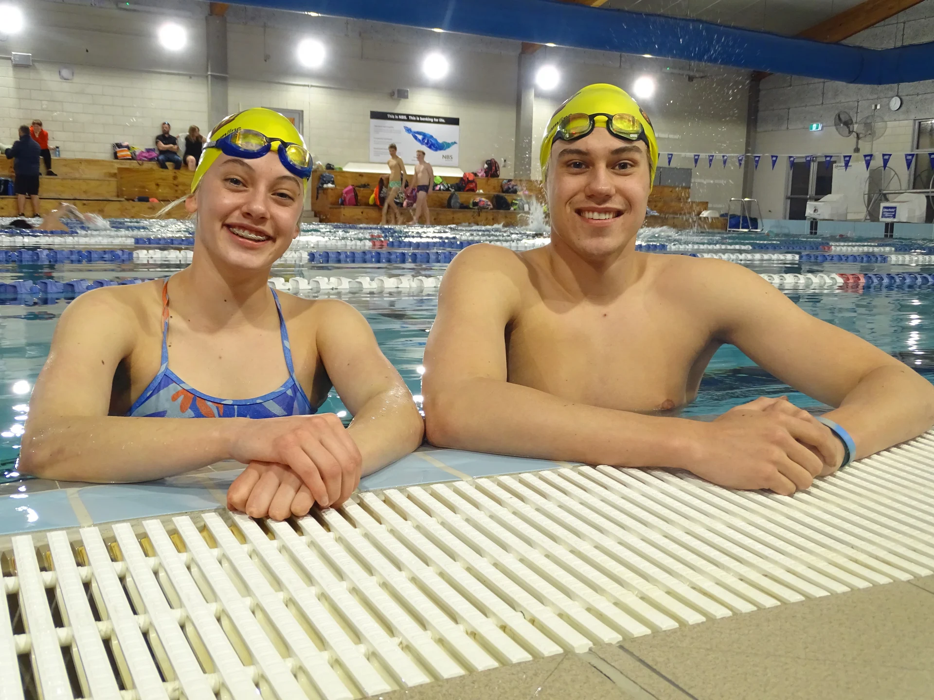Swimming siblings go for gold