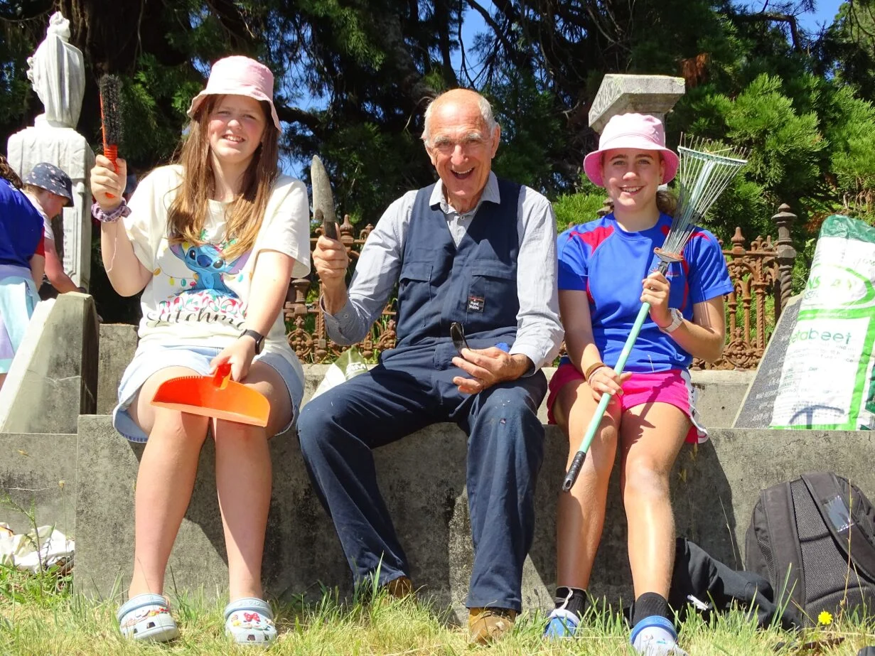 Student volunteer army sweeps through cemetery