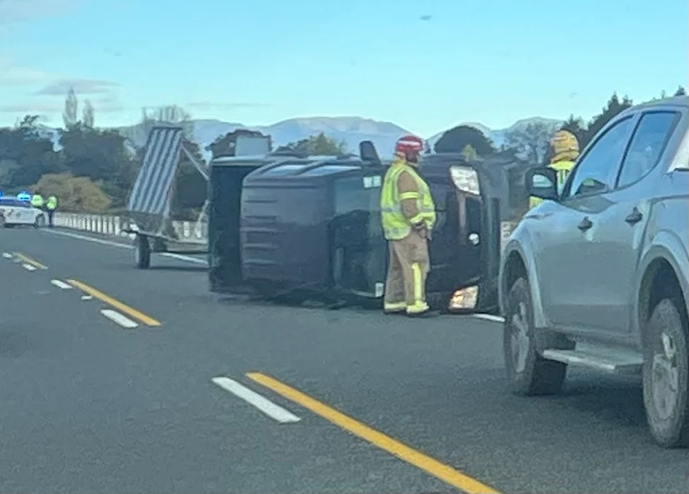 Ute and trailer overturns near Strong Loop