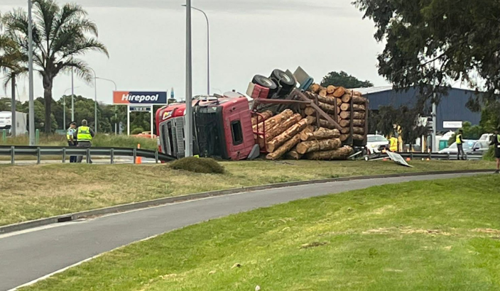 Logging truck rolls at SH6 roundabout
