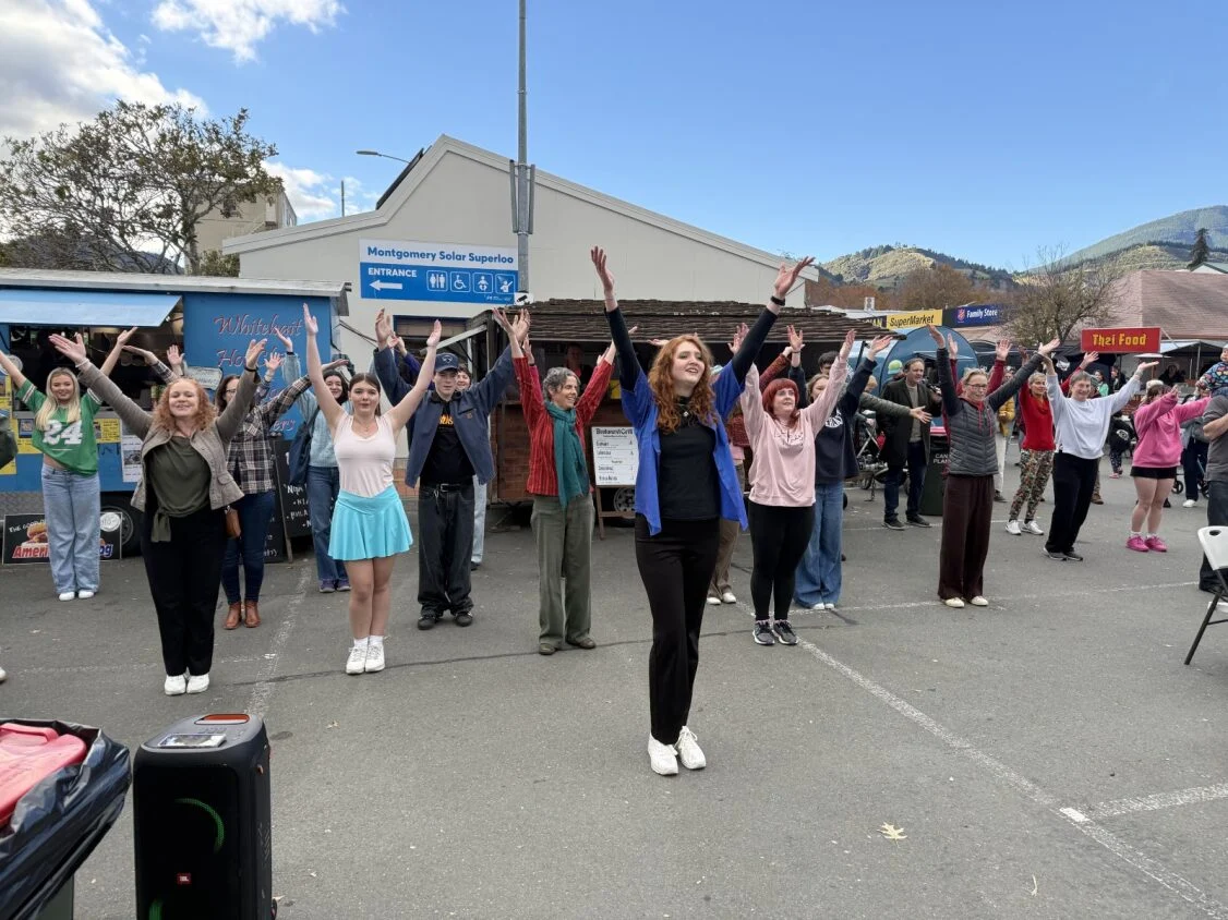Hospice flash mob surprises Nelson market shoppers