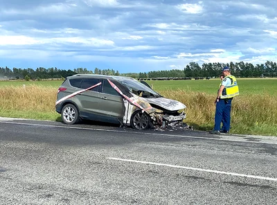 Car fire closes state highway