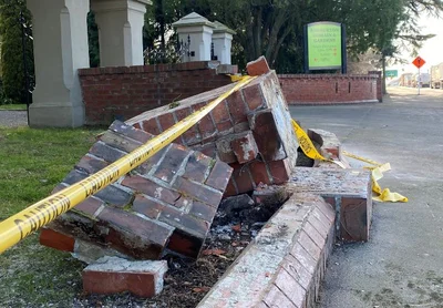 Car crashes into historic Domain wall