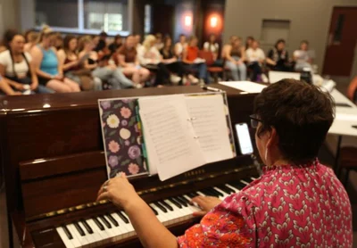 Singing school on song