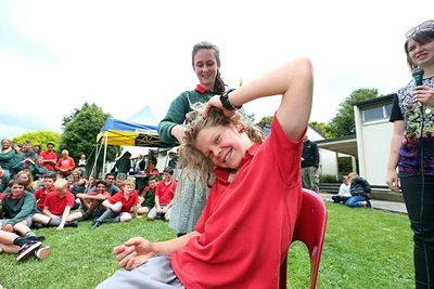Cole sheds dreads for cancer