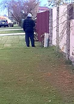 Police hunt for hooded man