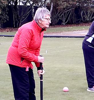 Croquet players braving the elements
