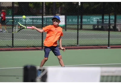 Tennis players young and old out chasing titles